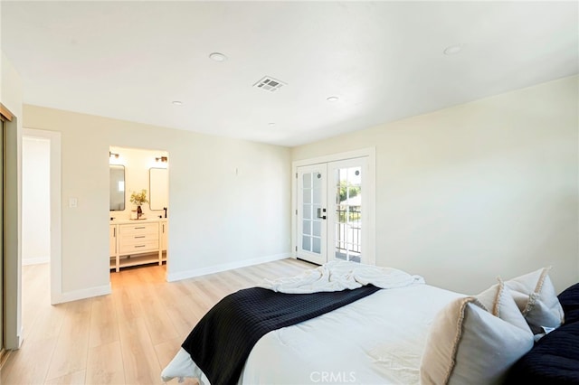 1478 N Park Ave, Pomona, CA 91768 - bedroom with light wood finished floors, ensuite bath, and french doors