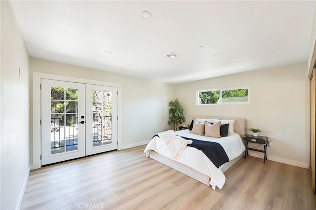 1478 N Park Ave, Pomona, CA 91768 - bedroom with french doors, multiple windows, access to exterior, light wood-style flooring, and recessed lighting