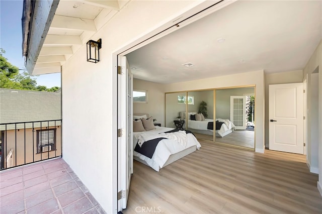 1478 N Park Ave, Pomona, CA 91768 - bedroom with light wood-style flooring and a closet