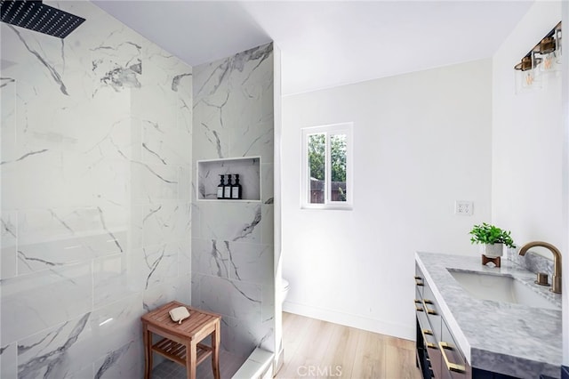 1478 N Park Ave, Pomona, CA 91768 - full bathroom with vanity, a marble finish shower, and wood finished floors