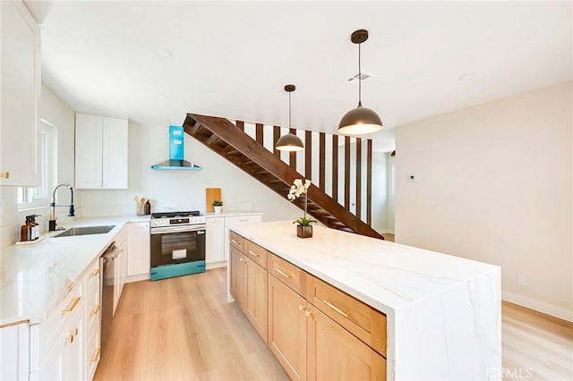 1478 N Park Ave, Pomona, CA 91768 - kitchen featuring stainless steel appliances, exhaust hood, light wood-style floors, a kitchen island, and light stone counters