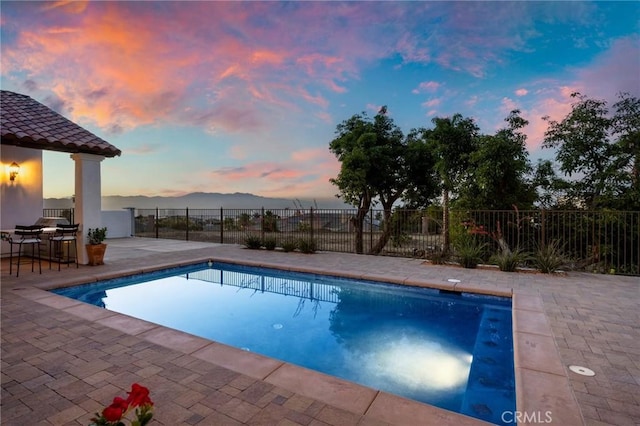 4368 Crown Ranch Rd, Corona, CA 92881 - pool at dusk with a patio, area for grilling, and a mountain view