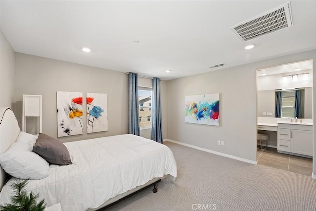 27753 Dyer Way, Canyon Country, CA 91387 - bedroom with light colored carpet, recessed lighting, ensuite bath, and built in desk