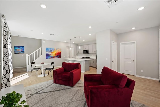 27753 Dyer Way, Canyon Country, CA 91387 - living area with stairs, light wood-type flooring, and recessed lighting