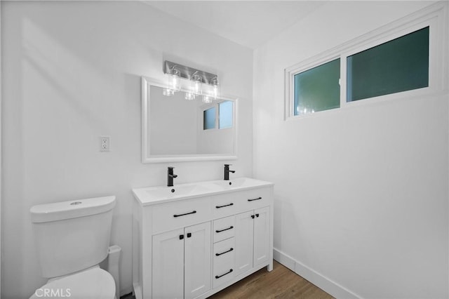 7848 Chastain Ave, Reseda, CA 91335 - bathroom featuring double vanity and wood finished floors