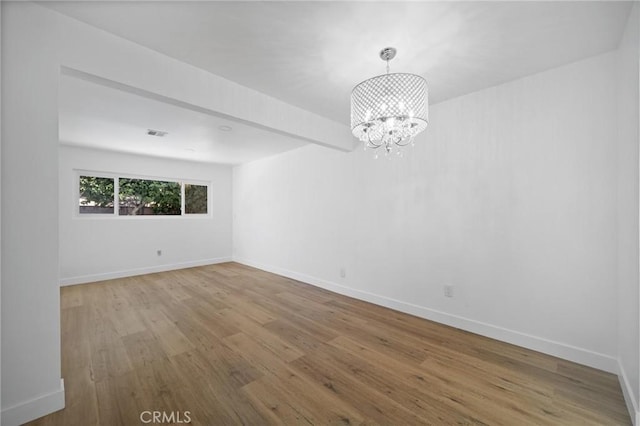 7848 Chastain Ave, Reseda, CA 91335 - empty room featuring a chandelier and wood finished floors