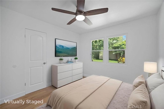 7848 Chastain Ave, Reseda, CA 91335 - bedroom with light wood finished floors and a ceiling fan
