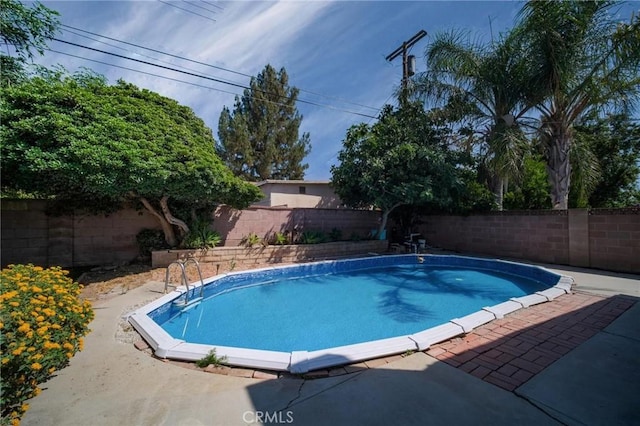 7848 Chastain Ave, Reseda, CA 91335 - view of pool with a fenced backyard and a patio area
