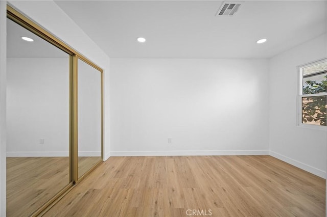 7848 Chastain Ave, Reseda, CA 91335 - unfurnished bedroom with recessed lighting, light wood-style flooring, and a closet