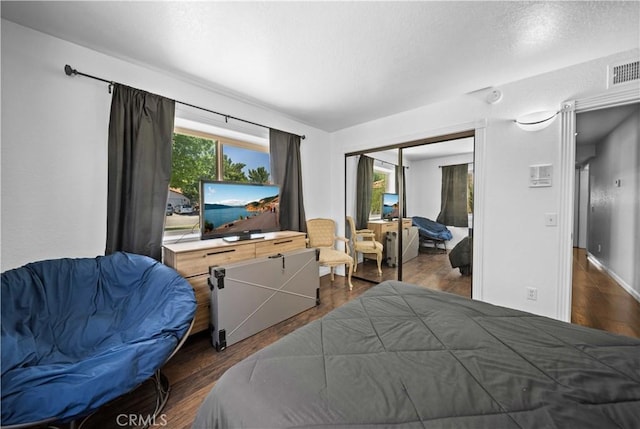 42903 Normandy Ln, Lancaster, CA 93536 - bedroom with a closet and dark wood finished floors