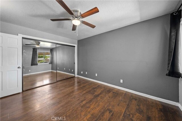 42903 Normandy Ln, Lancaster, CA 93536 - unfurnished bedroom with wood finished floors, a textured ceiling, a closet, and ceiling fan