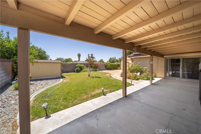 42903 Normandy Ln, Lancaster, CA 93536 - fenced backyard with a patio area and a storage shed