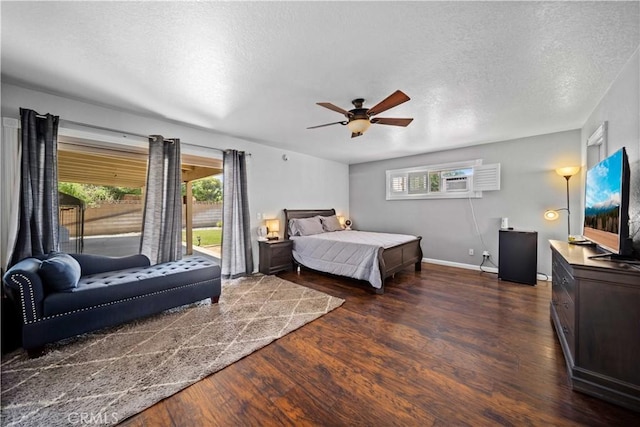 42903 Normandy Ln, Lancaster, CA 93536 - bedroom featuring access to outside, dark wood finished floors, a textured ceiling, and ceiling fan