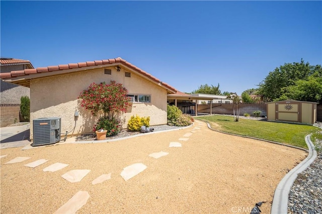 42903 Normandy Ln, Lancaster, CA 93536 - view of side of property featuring a shed, stucco siding, and a tiled roof