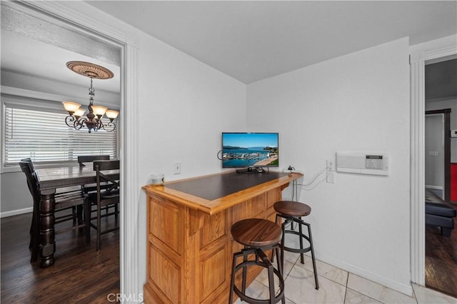 42903 Normandy Ln, Lancaster, CA 93536 - indoor dry bar with a chandelier and wood finished floors