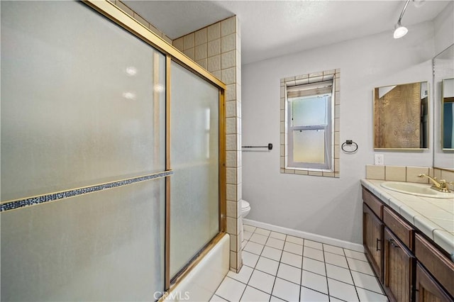 42903 Normandy Ln, Lancaster, CA 93536 - full bathroom featuring vanity, tile patterned floors, and enclosed tub / shower combo