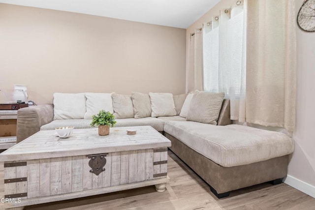 20224 Cohasset St Unit 12, Winnetka, CA 91306 - living room featuring baseboards and light wood-style floors