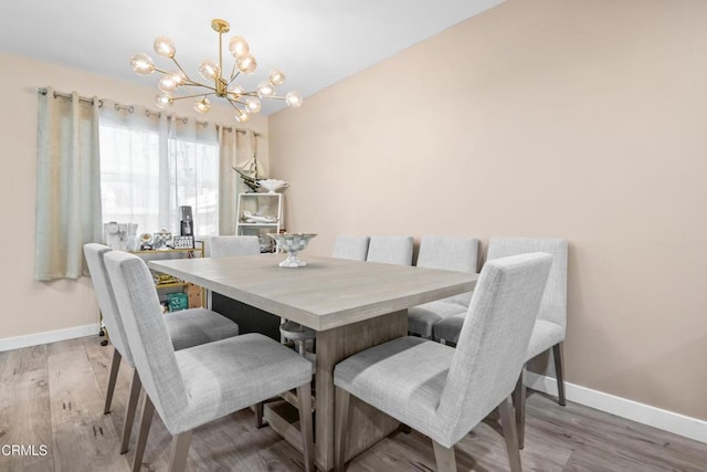 20224 Cohasset St Unit 12, Winnetka, CA 91306 - dining space with a chandelier and wood finished floors