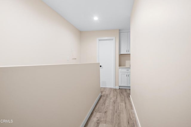20224 Cohasset St Unit 12, Winnetka, CA 91306 - hallway with light wood finished floors and recessed lighting