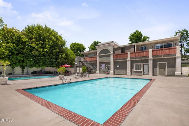 20224 Cohasset St Unit 12, Winnetka, CA 91306 - community pool featuring stairs and a patio