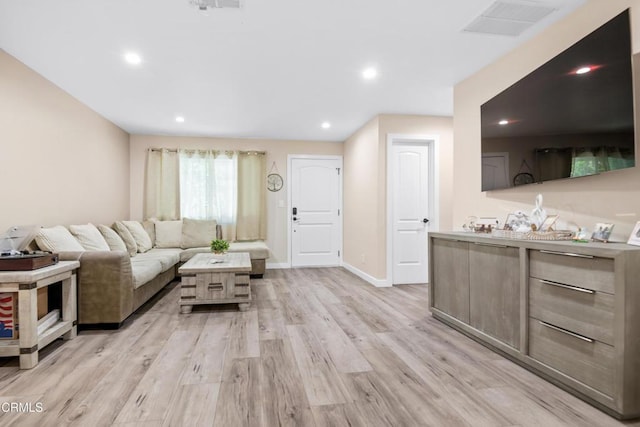 20224 Cohasset St Unit 12, Winnetka, CA 91306 - living room with light wood-style floors and recessed lighting