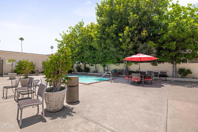 20224 Cohasset St Unit 12, Winnetka, CA 91306 - view of swimming pool featuring a fenced backyard and a patio
