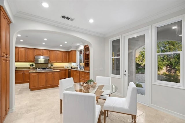 2 Tarascon, Newport Coast, CA 92657 - dining room with arched walkways, recessed lighting, and crown molding