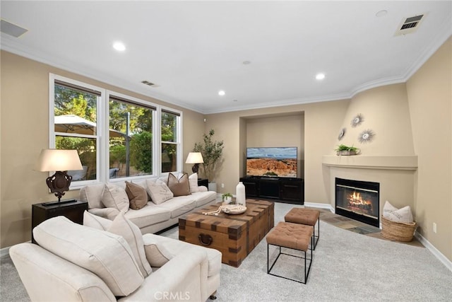 2 Tarascon, Newport Coast, CA 92657 - living area with a fireplace with flush hearth, crown molding, carpet floors, and recessed lighting