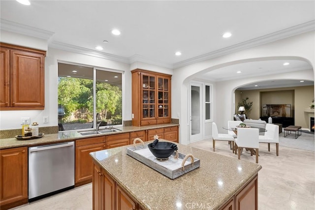2 Tarascon, Newport Coast, CA 92657 - kitchen featuring dishwasher, light stone counters, brown cabinetry, recessed lighting, and ornamental molding