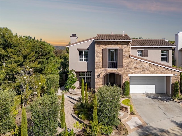2 Tarascon, Newport Coast, CA 92657 - view of front of home featuring a chimney, stone siding, concrete driveway, and stucco siding