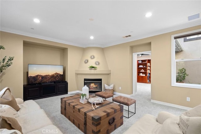2 Tarascon, Newport Coast, CA 92657 - living room featuring light colored carpet, recessed lighting, ornamental molding, and a fireplace