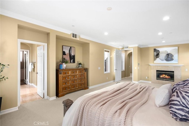 2 Tarascon, Newport Coast, CA 92657 - bedroom featuring ornamental molding, light carpet, a tile fireplace, recessed lighting, and arched walkways