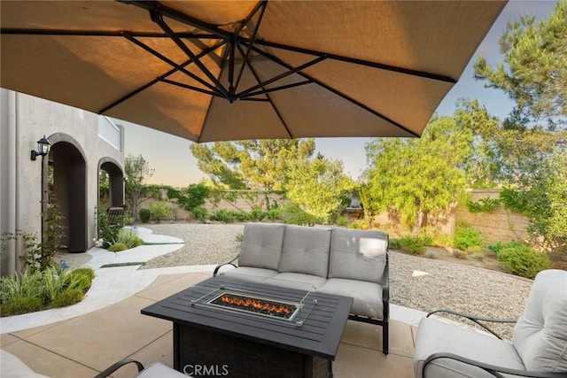 2 Tarascon, Newport Coast, CA 92657 - fenced backyard featuring a patio area and an outdoor living space with a fire pit