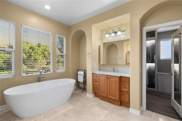2 Tarascon, Newport Coast, CA 92657 - bathroom with a freestanding bath, vanity, plenty of natural light, and recessed lighting