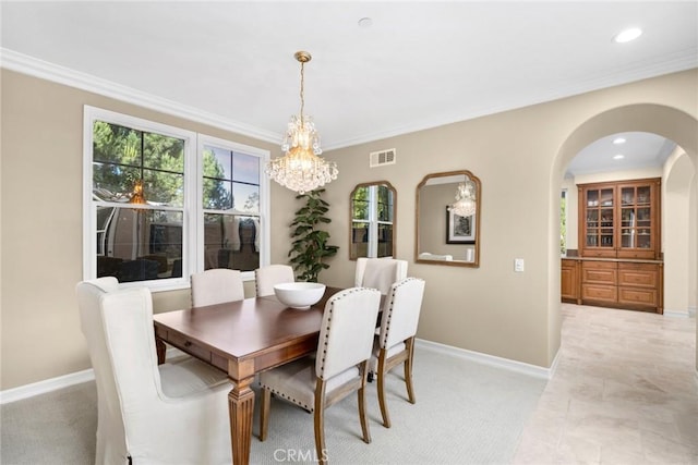 2 Tarascon, Newport Coast, CA 92657 - dining area with arched walkways, a chandelier, crown molding, light carpet, and recessed lighting