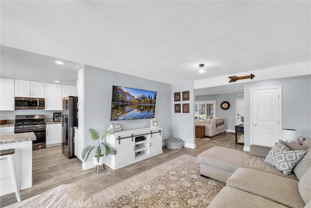 1232 Palos Verde Dr, Corona, CA 92878 - living room featuring light wood-style flooring and recessed lighting