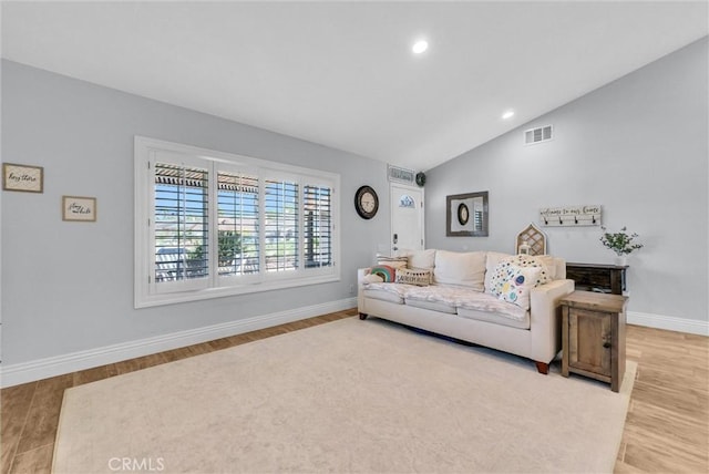 1232 Palos Verde Dr, Corona, CA 92878 - living area with wood finished floors, vaulted ceiling, and recessed lighting