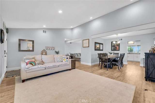 1232 Palos Verde Dr, Corona, CA 92878 - living room featuring light wood-style flooring, recessed lighting, and a chandelier