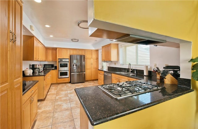 13520 Fenton Ave, Sylmar, CA 91342 - kitchen featuring appliances with stainless steel finishes, light tile patterned floors, a peninsula, recessed lighting, and dark stone countertops
