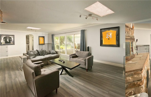 13520 Fenton Ave, Sylmar, CA 91342 - living area featuring arched walkways, wood finished floors, and ornamental molding
