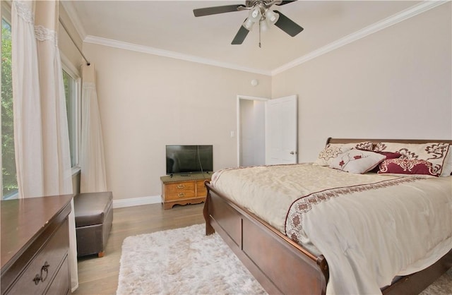 13520 Fenton Ave, Sylmar, CA 91342 - bedroom featuring ornamental molding, light wood finished floors, and a ceiling fan