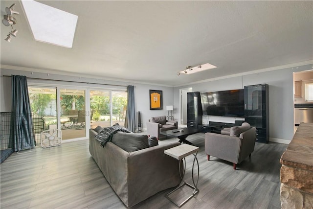 13520 Fenton Ave, Sylmar, CA 91342 - living area featuring crown molding, wood finished floors, and a skylight