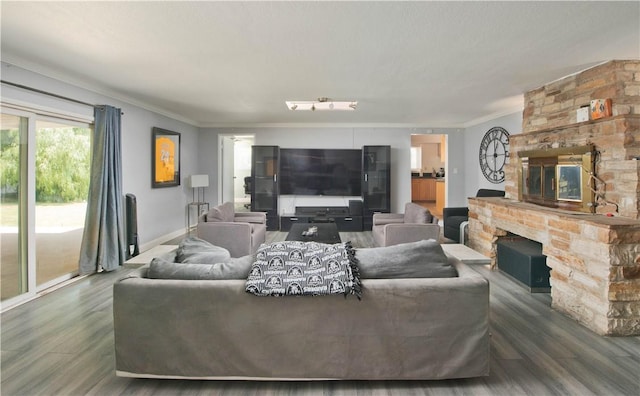 13520 Fenton Ave, Sylmar, CA 91342 - living area featuring a stone fireplace, ornamental molding, and wood finished floors