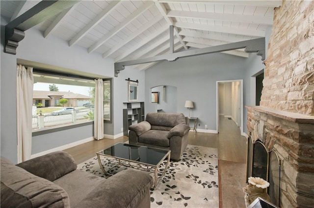 13520 Fenton Ave, Sylmar, CA 91342 - living area with a fireplace, wood finished floors, arched walkways, a barn door, and a wooden ceiling with exposed beams