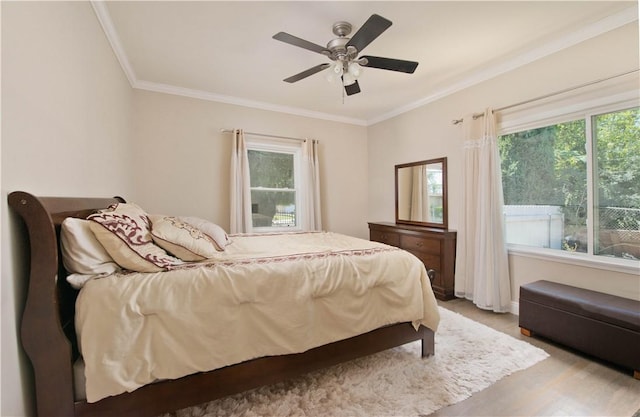 13520 Fenton Ave, Sylmar, CA 91342 - bedroom featuring crown molding, light wood-style floors, and a ceiling fan