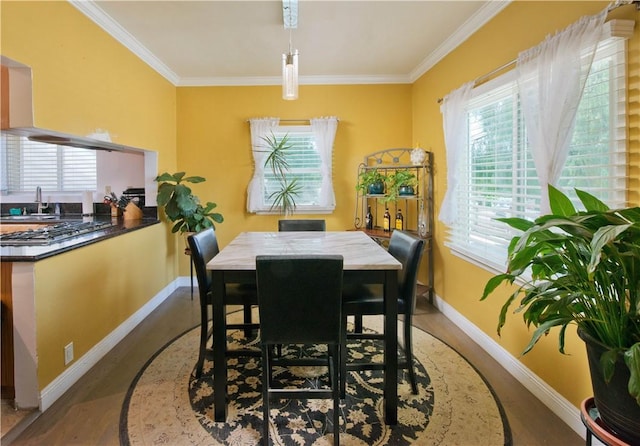 13520 Fenton Ave, Sylmar, CA 91342 - dining area featuring wood finished floors and ornamental molding