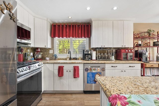 16110 Oak Springs Dr, Ramona, CA 92065 - kitchen featuring stainless steel appliances, tasteful backsplash, white cabinets, recessed lighting, and light wood-type flooring