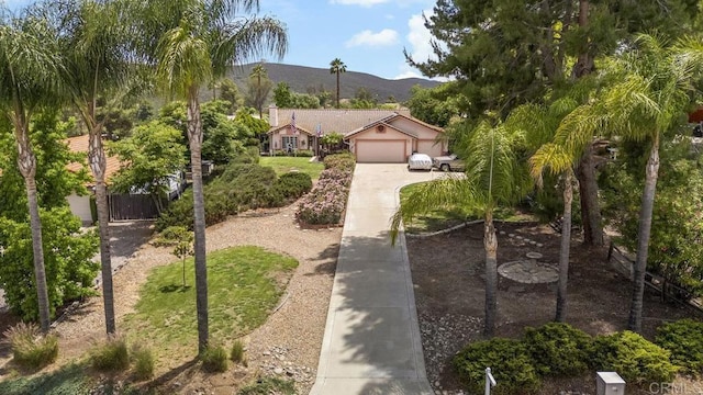 16110 Oak Springs Dr, Ramona, CA 92065 - view of front of house featuring concrete driveway, a mountain view, and a gate