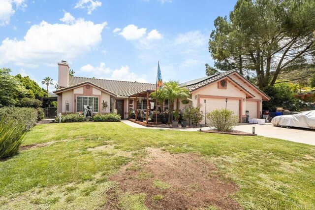 16110 Oak Springs Dr, Ramona, CA 92065 - ranch-style house with roof mounted solar panels, a chimney, concrete driveway, stucco siding, and a garage