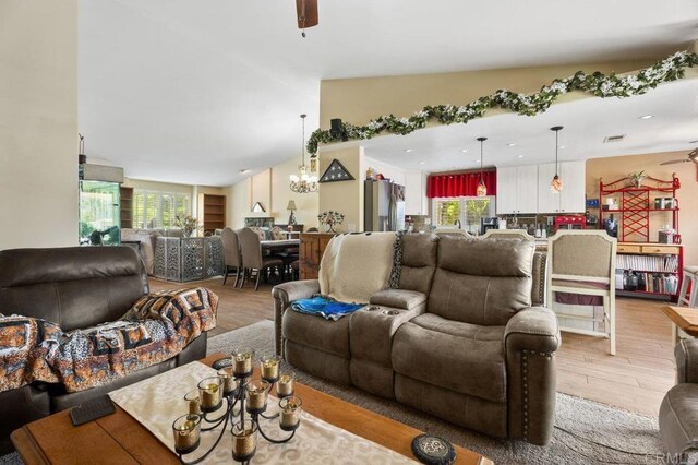 16110 Oak Springs Dr, Ramona, CA 92065 - living room featuring wood finished floors, ceiling fan, and a chandelier